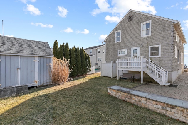 rear view of house with a lawn