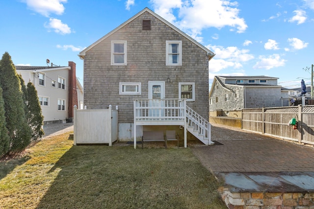 rear view of house with a lawn