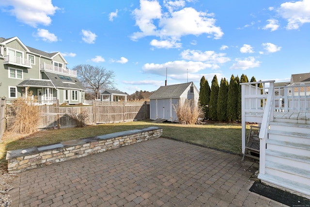 view of patio featuring a shed