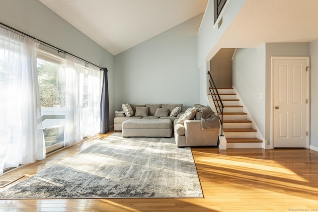 131 Hunters Ln Unit 131, Newington, CT 06111 - living room with vaulted ceiling and wood-type flooring