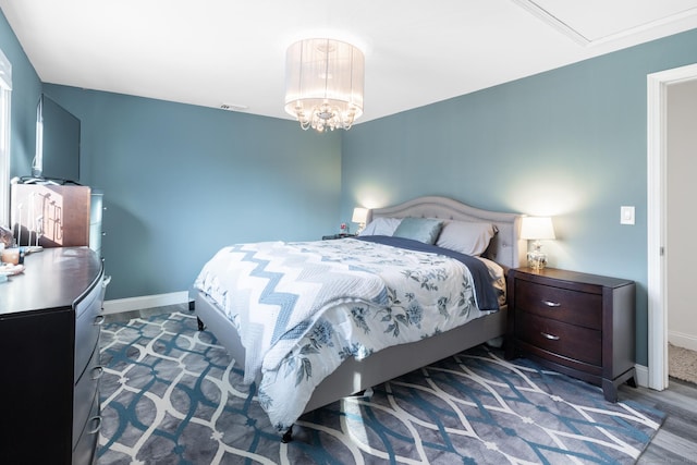 bedroom with dark wood-type flooring