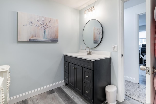 bathroom featuring hardwood / wood-style floors and vanity