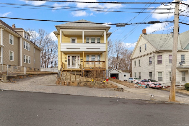 view of front of property with a balcony