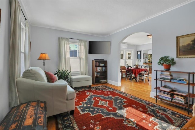 living room with ornamental molding and hardwood / wood-style floors