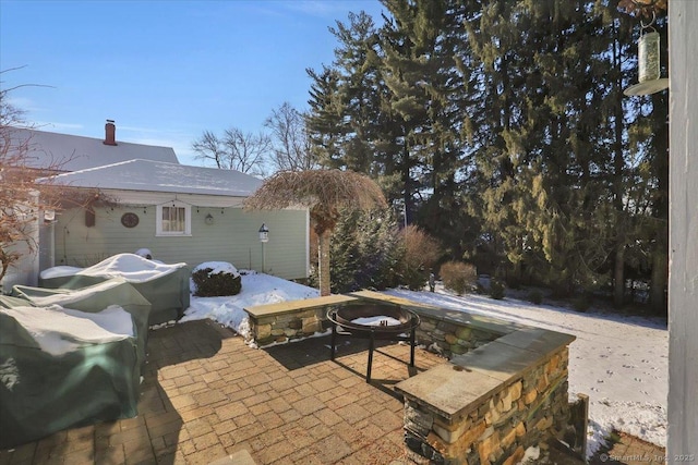 view of patio / terrace featuring an outdoor fire pit