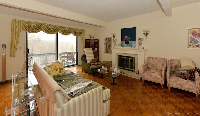 living room with beam ceiling and dark parquet floors