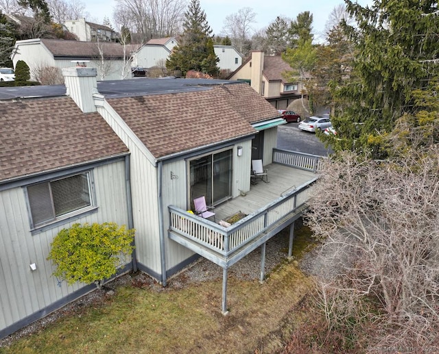 rear view of property with a wooden deck