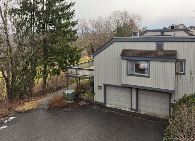 view of property exterior featuring a garage