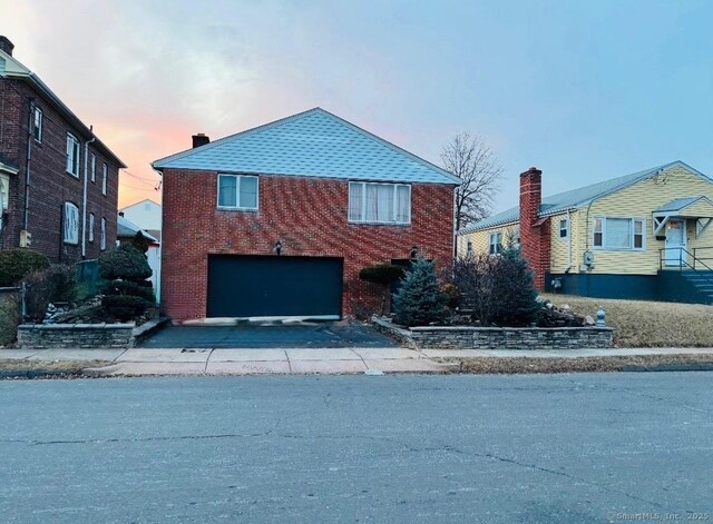 front of property with a garage