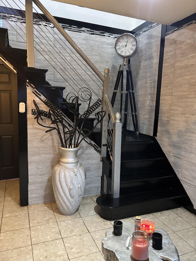 stairs featuring tile patterned floors