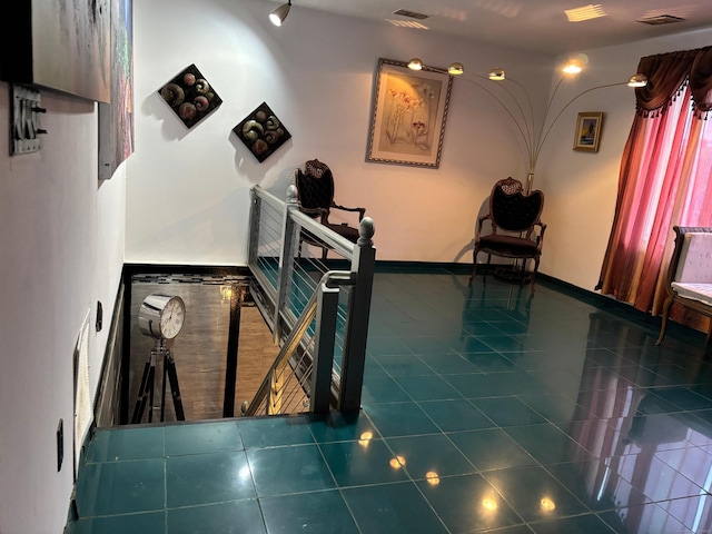 stairway with tile patterned flooring