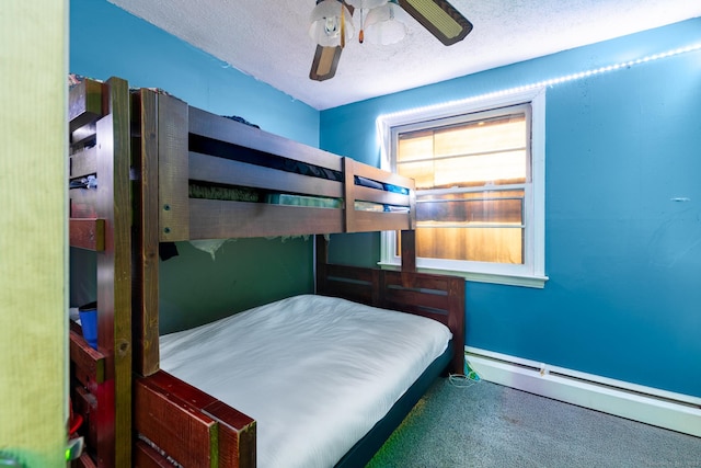 unfurnished bedroom featuring ceiling fan, a textured ceiling, and a baseboard heating unit