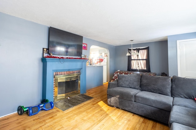 living room featuring hardwood / wood-style flooring and a fireplace