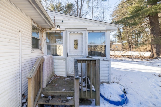 view of snow covered property entrance