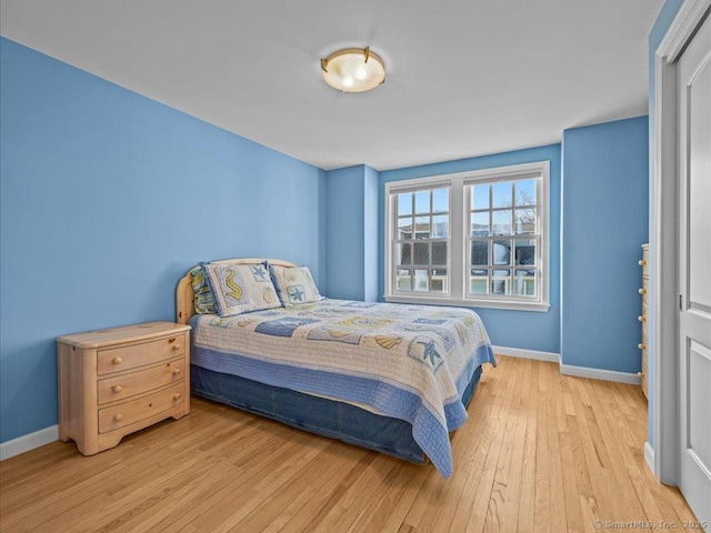 bedroom with light hardwood / wood-style floors