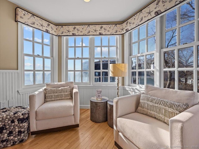 living area with hardwood / wood-style flooring