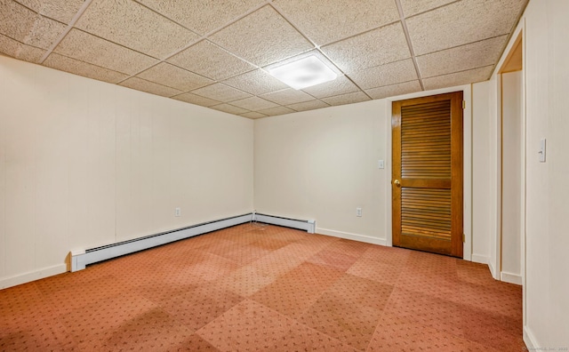 spare room featuring carpet and a baseboard radiator