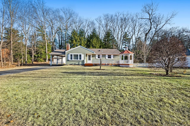 ranch-style house with a gazebo, a front lawn, and a carport