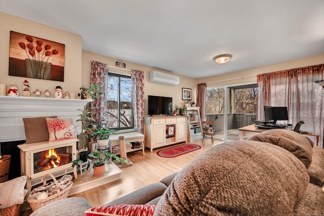 living room with light hardwood / wood-style flooring and a wall mounted AC