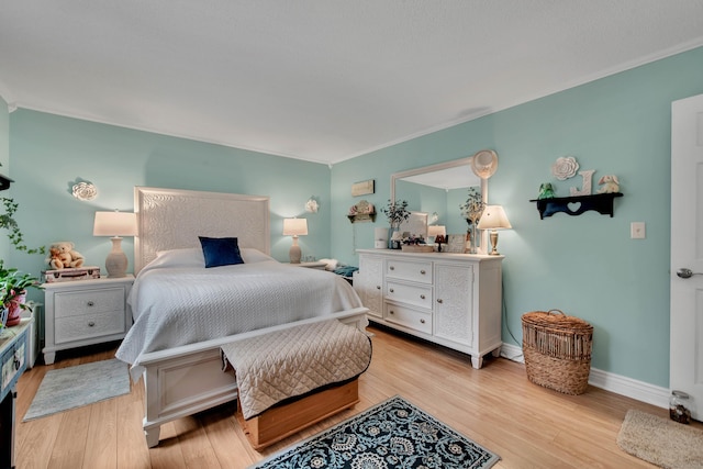 bedroom with light hardwood / wood-style floors