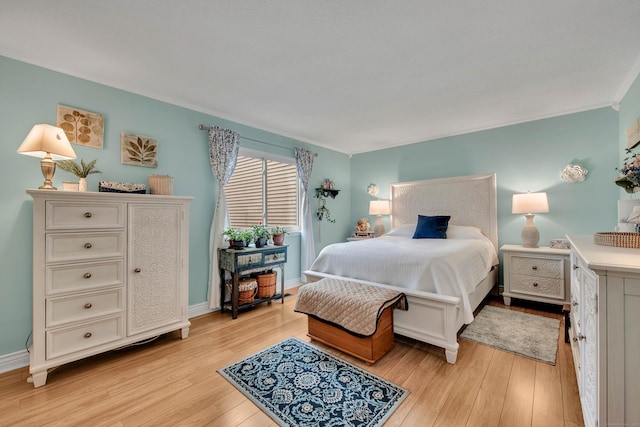 bedroom with light hardwood / wood-style flooring