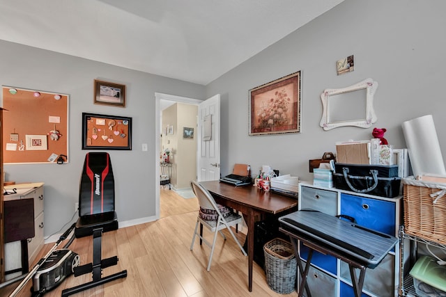 office with light hardwood / wood-style flooring