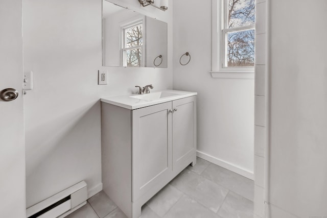 bathroom with vanity and baseboard heating