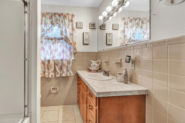 bathroom with tile walls, tile patterned floors, and vanity