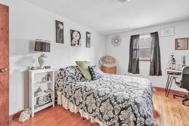 bedroom featuring wood-type flooring