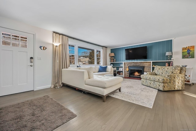 living room featuring a fireplace and hardwood / wood-style floors