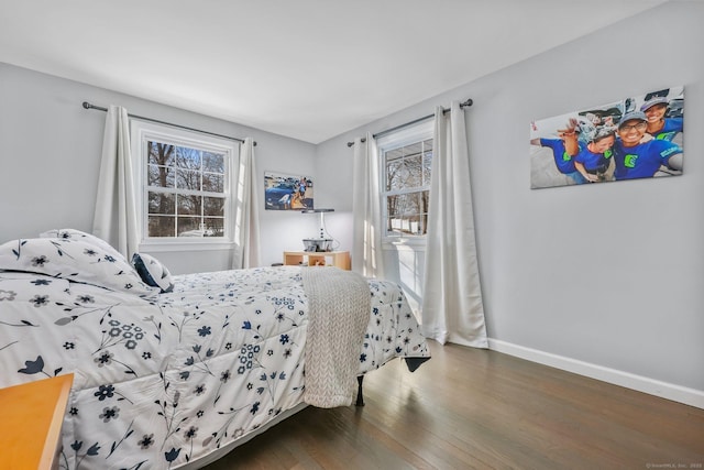 bedroom featuring dark hardwood / wood-style flooring