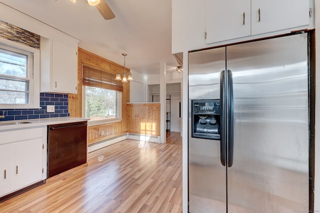 kitchen with white cabinetry, stainless steel refrigerator with ice dispenser, light wood-type flooring, dishwasher, and pendant lighting