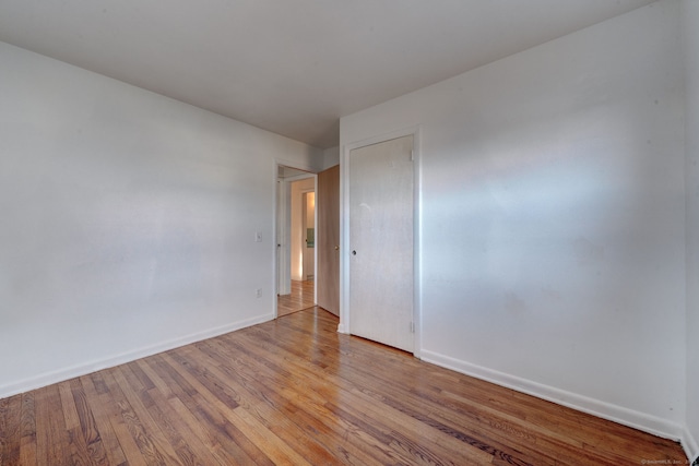 unfurnished room featuring light hardwood / wood-style floors