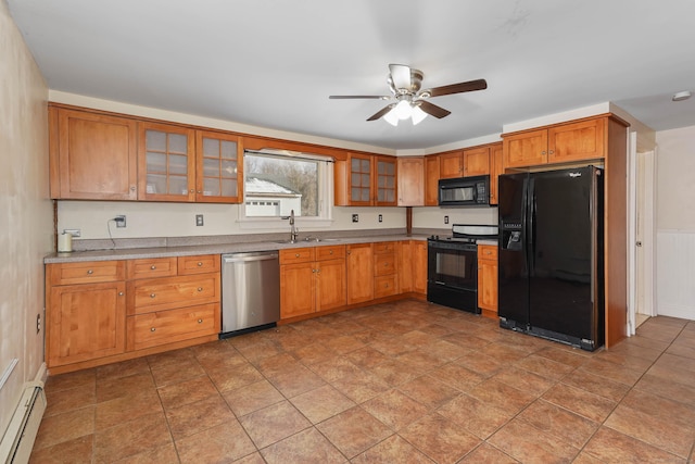 kitchen featuring sink, black appliances, ceiling fan, and baseboard heating