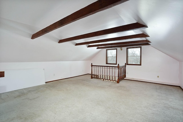 additional living space featuring light carpet and lofted ceiling