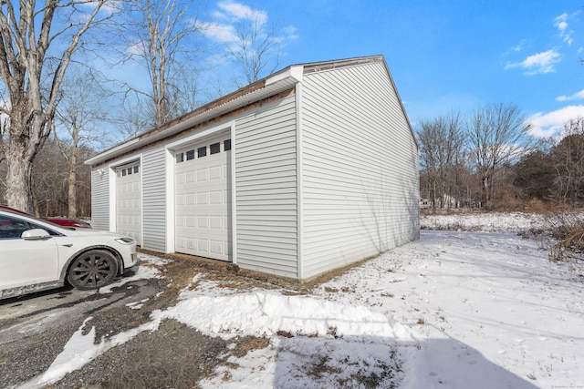 view of snow covered garage