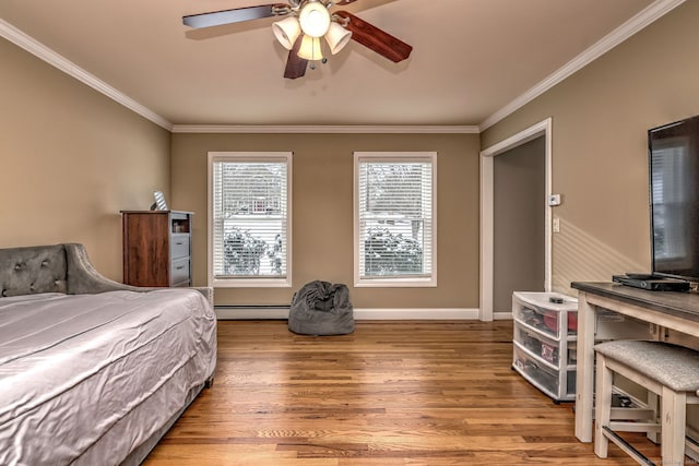 bedroom featuring a baseboard radiator, multiple windows, light hardwood / wood-style floors, ornamental molding, and ceiling fan