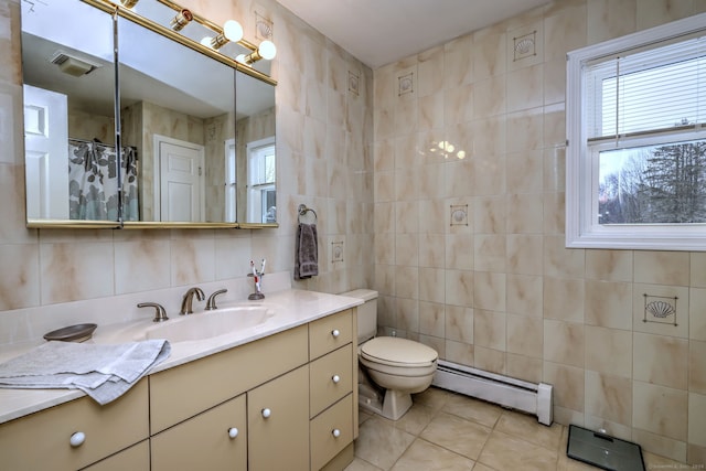 bathroom with toilet, tile walls, baseboard heating, tile patterned floors, and vanity