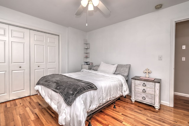 bedroom with a closet, ceiling fan, and light hardwood / wood-style floors