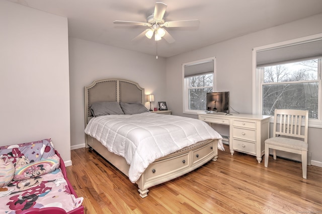 bedroom featuring light wood-type flooring and ceiling fan