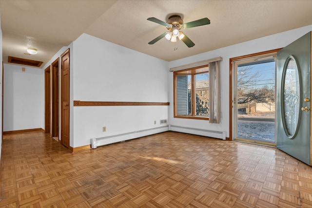 unfurnished room featuring ceiling fan, a baseboard radiator, light parquet floors, and a textured ceiling