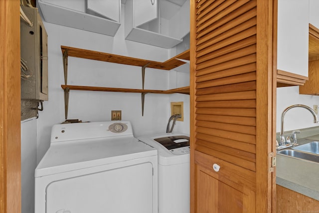 laundry room with sink and washer and clothes dryer