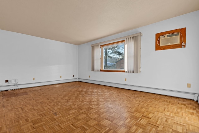 unfurnished room featuring light parquet flooring, a baseboard radiator, and a wall unit AC