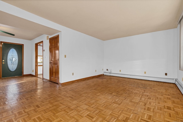 interior space featuring a baseboard heating unit and light parquet floors