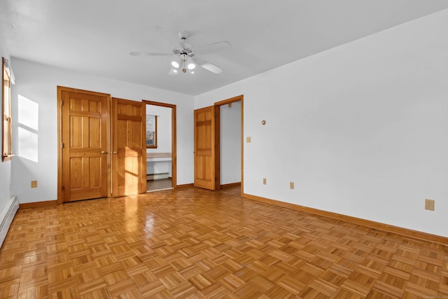 unfurnished bedroom featuring ceiling fan, light parquet flooring, and a baseboard radiator