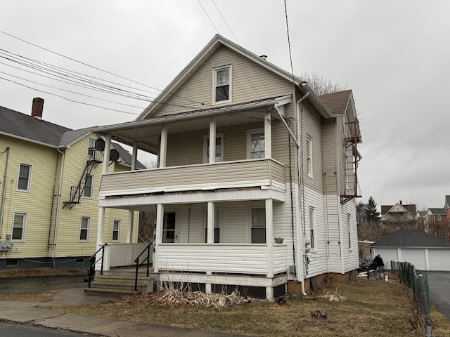 view of front of home featuring a balcony and a porch