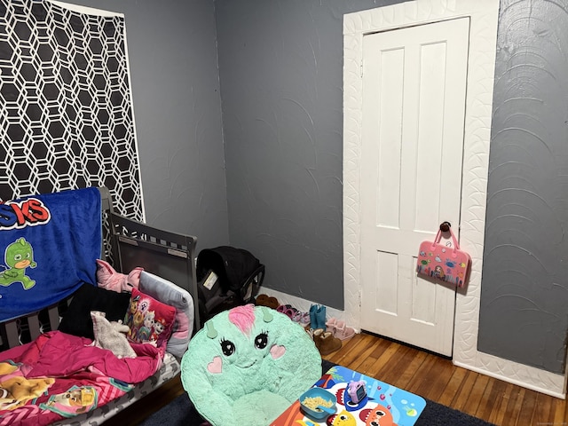 bedroom featuring hardwood / wood-style floors