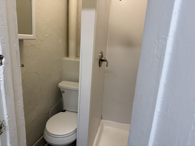 bathroom featuring toilet