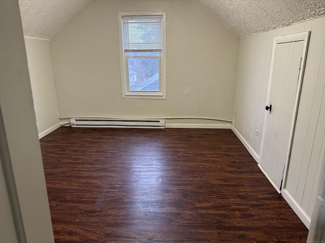 bonus room with vaulted ceiling, dark hardwood / wood-style floors, and a textured ceiling