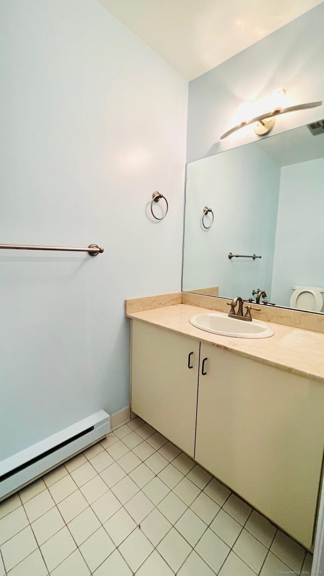 bathroom featuring vanity, tile patterned floors, and a baseboard radiator